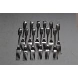 A MATCHED SET OF TWELVE HALLMARKED SILVER FIDDLE AND THREAD TABLE FORKS BY CHAWNER & CO (GEORGE