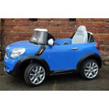 AN ELECTRIC POWERED CHILDS MINI COOPER S TOY CAR, L 105 cm, W 66 cm, H 60 cm