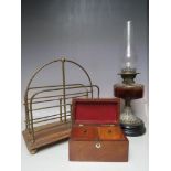 A SELECTION OF ITEMS TO INCLUDE A BRASS FRAMED MAGAZINE RACK, together with a twin burner oil