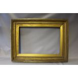 A NINETEENTH CENTURY GOLD FRAME, with egg and dart design to outer edge and gold slip, width of