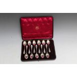 WEST & SONS OF DUBLIN - A CASED SET OF ELEVEN HALLMARKED SILVER TEASPOONS CARRYING LONDON 1895