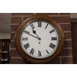 AN ANTIQUE OAK CASED CIRCULAR WALL CLOCK, with single fusee movement, dial Dia. 30 cm, key