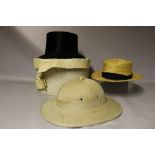 A VINTAGE VIETNAMESE PITH HELMET, together with a 'Luton Curic Straw Boater' and a Dunn & Co silk