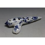 A BLUE AND WHITE PORCELAIN WHISTLE, or flute, decorated in an onion pattern type design, W 15.5 cm