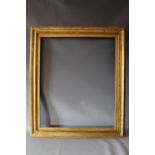 A 19TH CENTURY CONTINENTAL DECORATIVE GOLD FRAME WITH GOLD SLIP, frame W 6.5 cm, slip rebate 77.5 cm