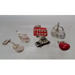 A SELECTION OF THOMAS SABO STERLING SILVER CHARMS, comprising a London red bus, black cab, a