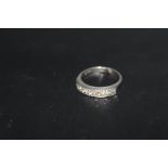 A DIAMOND SET PLATINUM HALF ETERNITY RING, stamped PLAT, approx weight 5.5g, with resize section