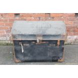 A LARGE VINTAGE DOMED TRAVELLING TRUNK, with leather carry handles, with original paper tag 'T.A.
