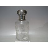A CONTINENTAL SILVER TOPPED VANITY JAR, with etched floral engraving to glass body, complete with