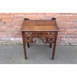 A 19TH CENTURY OAK LOWBOY, with a single full length drawer above two shorter drawers and carved