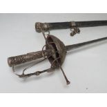 A SMALL CEREMONIAL RAPIER WITH LEATHER CHAPE, embossed detail to guard, quillion and handle engraved