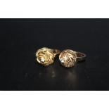 A 9CT GOLD DRESS RING, of a domed swirl form, together with an unmarked example, 9ct example
