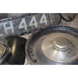THREE BENTLEY WHEEL TRIMS, a rear illuminated number plate, two head light bowls, various light