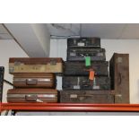 A COLLECTION OF NINE ASSORTED VINTAGE SUITCASES, largest 65 x 51 cm