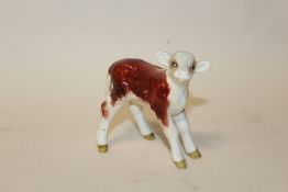 A SMALL BESWICK HEREFORD CALF FIGURE, facing right