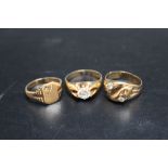 THREE HALLMARKED 9 CARAT GOLD DRESS RINGS, to include a signet example - ring size V, approx