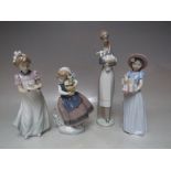 A COLLECTION OF FOUR LLADRO FIGURES, comprising 'New Shoes' 6487, 'Girl With Cake' 5429, Girl With