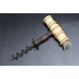 A VINTAGE CORKSCREW, with bone handle and brush, H 14.5 cm