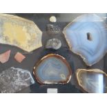 A FRAMED AND GLAZED SET OF VARIOUS GEOLOGICAL SAMPLES, 26 x 37 cm