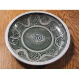 A BESPOKE POTTERY SHALLOW BOWL WITH BENTLEY WINGS LOGO TO CENTRE, Dia. 29.5 cm