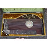 AN ANTIQUE 'M AMBERGER MUNCHEN' 34 STRING CONCERT ZITHER, with mother of pearl inlaid floral