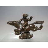 AN ORIENTAL STYLE BRONZE MYTHICAL FIGURE OF A YOUNG BOY RIDING A HORSE, L 15.5 cm