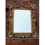 A LATE EIGHTEENTH / EARLY NINETEENTH CENTURY GILT FLORENTINE MIRROR, with scrolling acanthus leaf