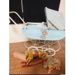 A VINTAGE DOLLS PRAM, together with a model rocking horse etc. (3)