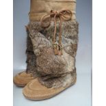 TWO PAIRS OF MOCCASIN 'FESTIVAL' TYPE BOOTS, comprising a pair of suede and coney fur Tory Burch