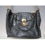 A MICHAEL KORS BLACK LEATHER HANDBAG, with gold tone hardware, with detachable shoulder strap,