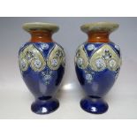 A PAIR OF ROYAL DOULTON ART NOUVEAU STYLE BALUSTER VASES, with typical period decoration,