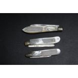 A COLLECTION OF THREE HALLMARKED SILVER BLADED MOTHER OF PEARL FRUIT KNIVES, various dates and