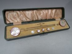 A LATE 19TH / EARLY 20TH CENTURY CASED SET OF HAT PINS AND BUTTONS, with mother of pearl and