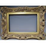 A 19TH CENTURY PIERCED AND SWEPT GOLD FRAME WITH GOLD SLIP, frame W 8 cm, slip rebate 314 x 48.5 cm,