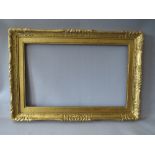 A LATE 19TH / EARLY 20TH CENTURY DECORATIVE GOLD FRAME WITH GOLD SLIP, frame W 45 cm, slip rebate