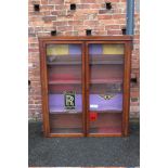 AN EDWARDIAN MAHOGANY GLAZED BOOKCASE WITH 'ROLLS ROYCE' AND 'BENTLEY' STICKERS, H 147 cm, W 119 cm,