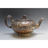 A HALLMARKED VICTORIAN SILVER TEAPOT - BIRMINGHAM 1877, with typical victorian high embellishment,