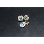 A HALLMARKED 22 CARAT GOLD PENDANT AND EARRINGS SET, set with aqua marine style stones and diamonds,