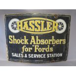 A VINTAGE ENAMELLED SIGN FOR 'HASSLER SHOCK ABSORBERS', W 71 cm