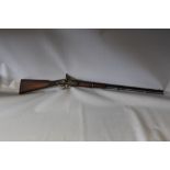 A NINETEENTH / TWENTIETH CENTURY PERCUSSION RIFLE, with metal ramrod, length of barrel 81 cm,