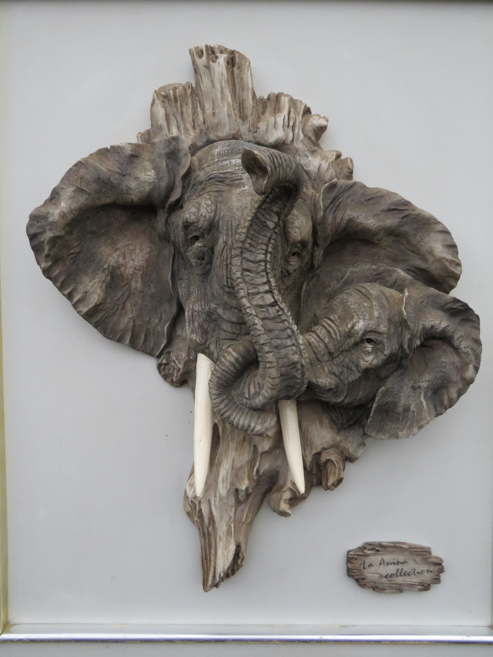 CROSA (XXI) - A RESIN SCULPTURE OF TWO ENTWINED ELEPHANT HEADS FORMING THE SHAPE OF AFRICA,