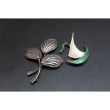 A DANISH SILVER BROOCH, together with an enamel brooch depicting a sail boat, H 4 cm (2)