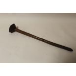 A VINTAGE AUSTRALIAN ABORIGINAL THROWING CLUB, having a conical head and pointed tip, L 57 cm