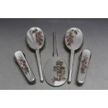 A FIVE PIECE HALLMARKED SILVER AND ENAMEL DRESSING TABLE SET BY W I BROADWAY & CO - BIRMINGHAM