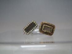 TWO ANTIQUE YELLOW METAL MOURNING BROOCHES, one having seed pearl border to edge, largest W 2 cm