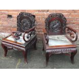 A PAIR OF ORIENTAL HARDWOOD MARBLE CARVED ARMCHAIRS, having pierced open backs with carved
