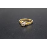 AN 18CT ILLUSION SET OLD CUT DIAMOND SOLITAIRE RING, of an estimated quarter carat diamond weight,