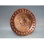 KESWICK SCHOOL OF INDUSTRIAL ART COPPER TRAY, of circular form, repouse decoration of a Griffin to