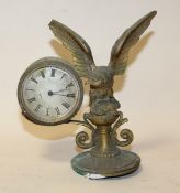 AN ANTIQUE BRASS MOUNTABLE CLOCK, with eagle and prey surmount, dial marked Corke A/F, H 17 cm, W 17