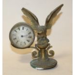 AN ANTIQUE BRASS MOUNTABLE CLOCK, with eagle and prey surmount, dial marked Corke A/F, H 17 cm, W 17